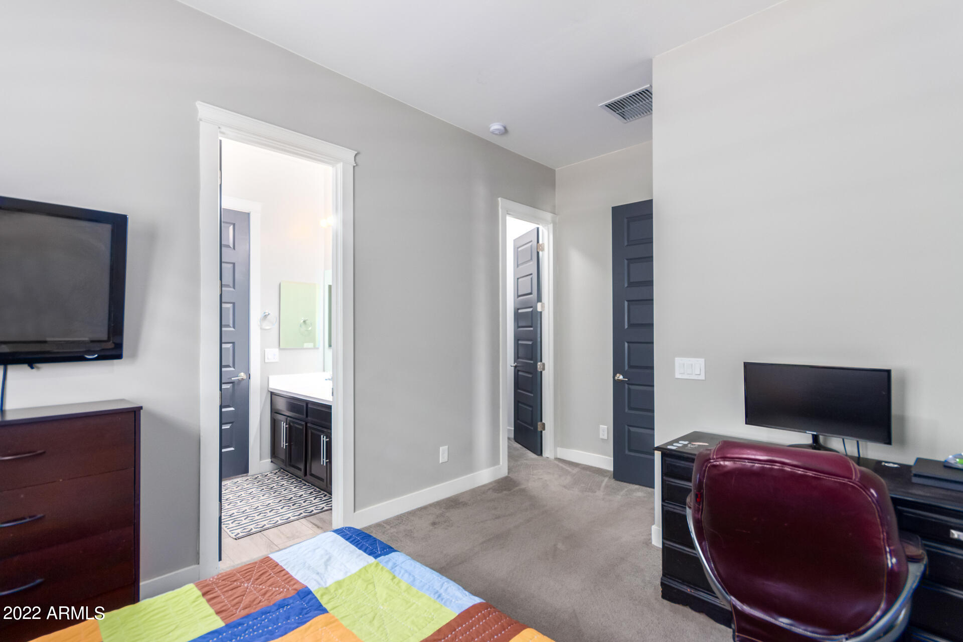 28001 92nd Avenue Peoria, AZ 85383 - Photo 31 of 45 a living room with furniture and a flat screen tv