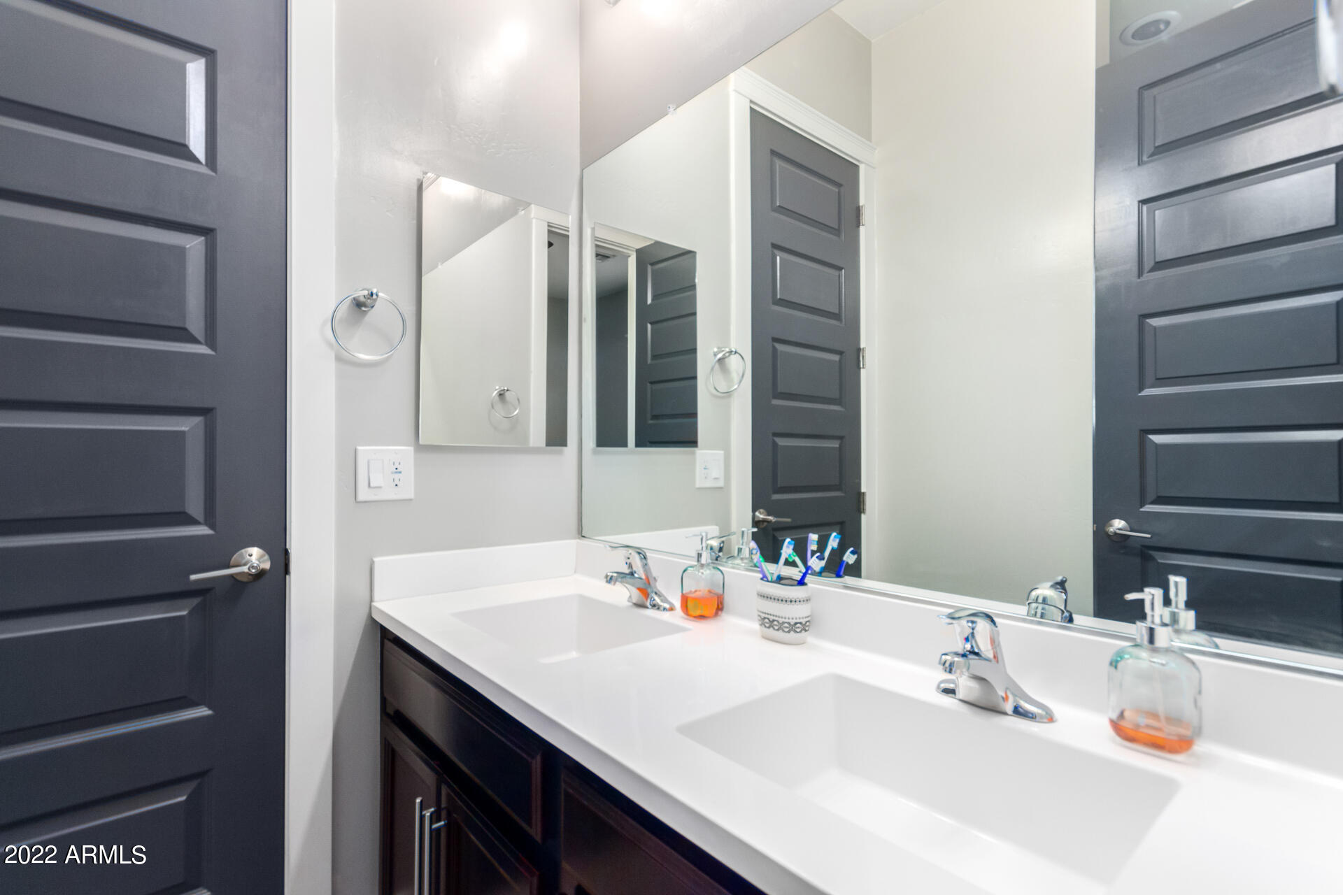 28001 92nd Avenue Peoria, AZ 85383 - Photo 32 of 45 a bathroom with a sink and a mirror