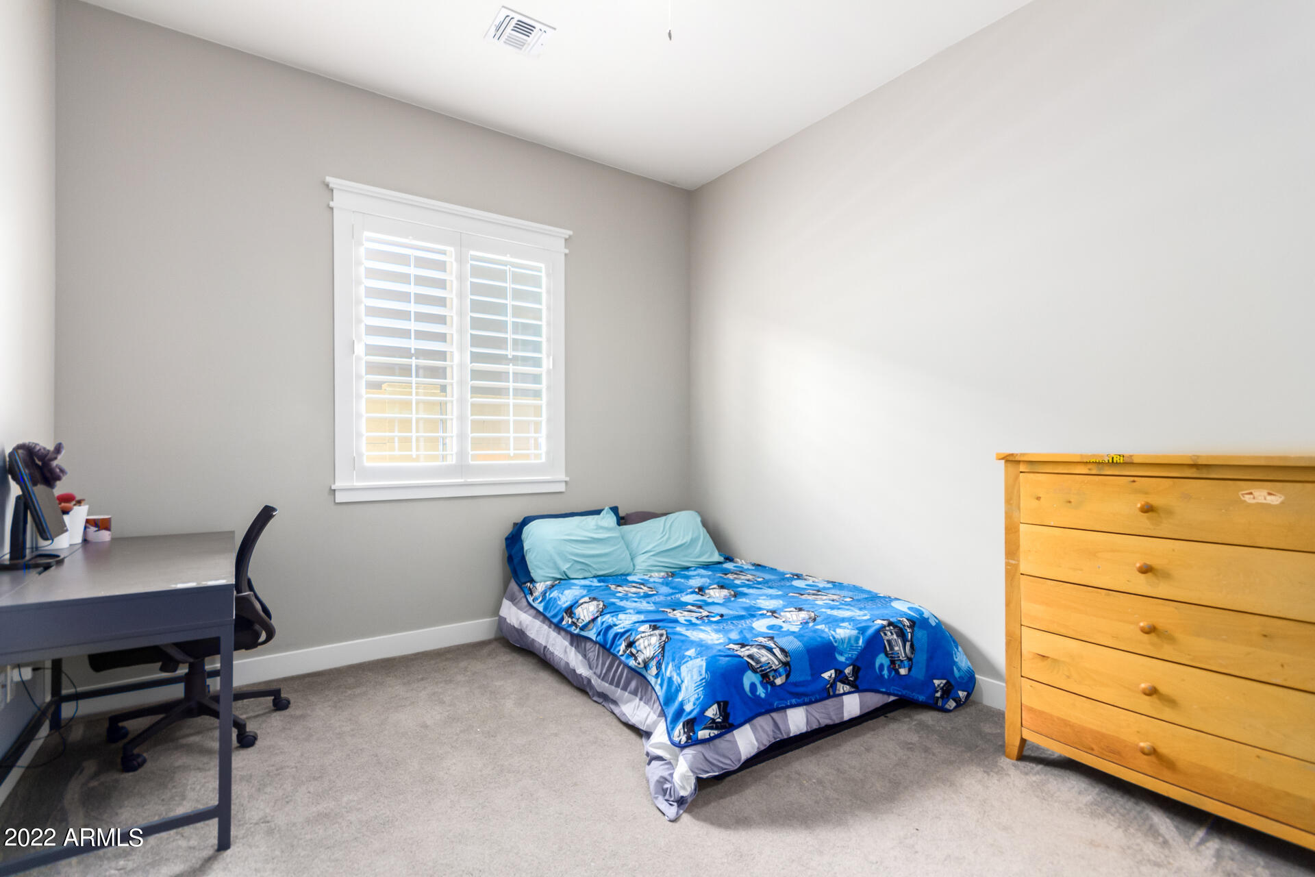 28001 92nd Avenue Peoria, AZ 85383 - Photo 35 of 45 a bedroom with a bed and a window