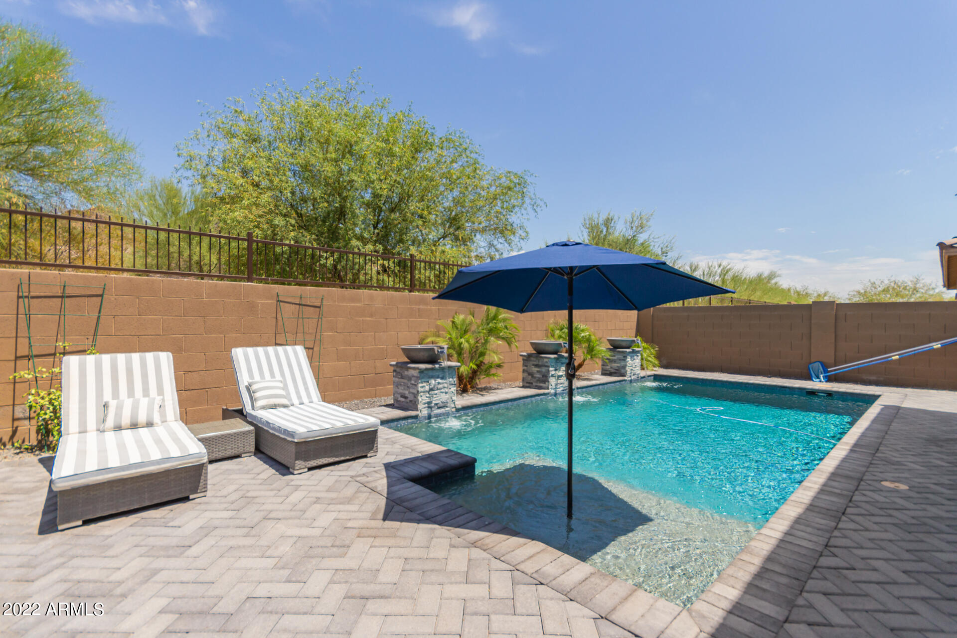 28001 92nd Avenue Peoria, AZ 85383 - Photo 42 of 45 a view of a tables and chairs under an umbrella
