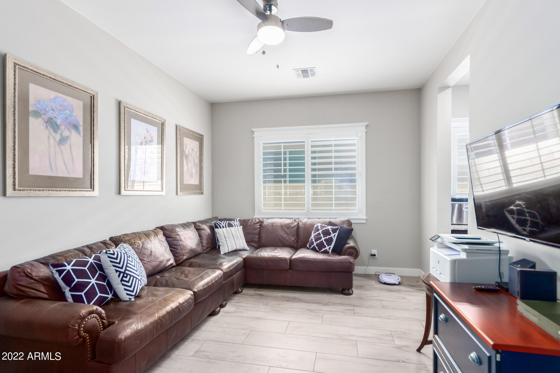 28001 92nd Avenue Peoria, AZ 85383 - Photo 6 of 45 a living room with furniture flat screen tv and a window