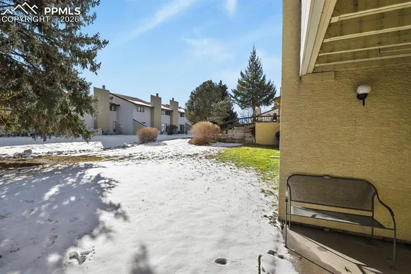 a view of a backyard with a sitting area