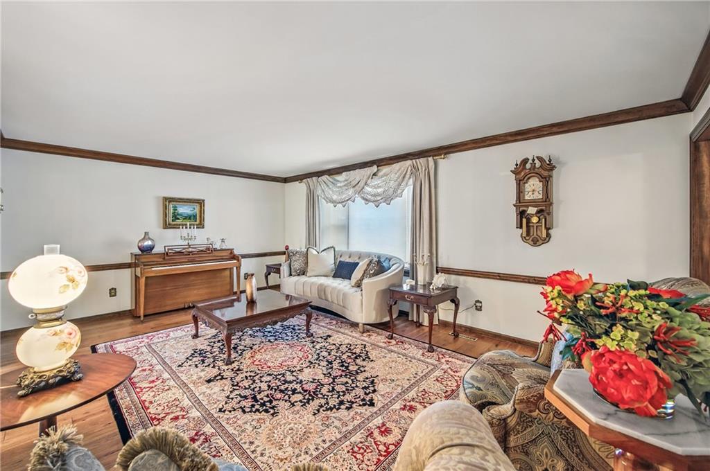 689 Tanglewood Road Hermitage, PA 16148 - Photo 14 of 42 a living room with furniture and flowers