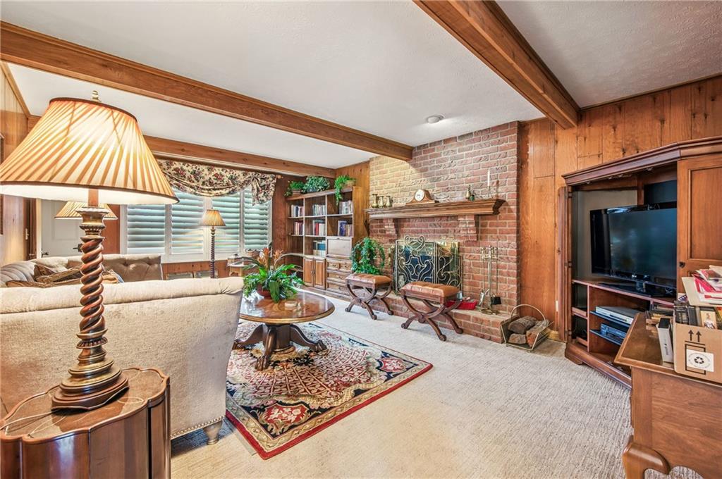 689 Tanglewood Road Hermitage, PA 16148 - Photo 16 of 42 a living room with furniture and a flat screen tv