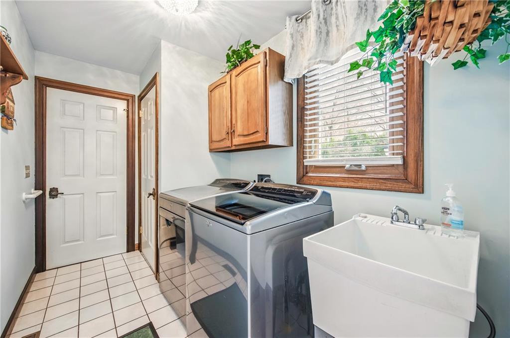 689 Tanglewood Road Hermitage, PA 16148 - Photo 17 of 42 a kitchen with a sink appliances and cabinets