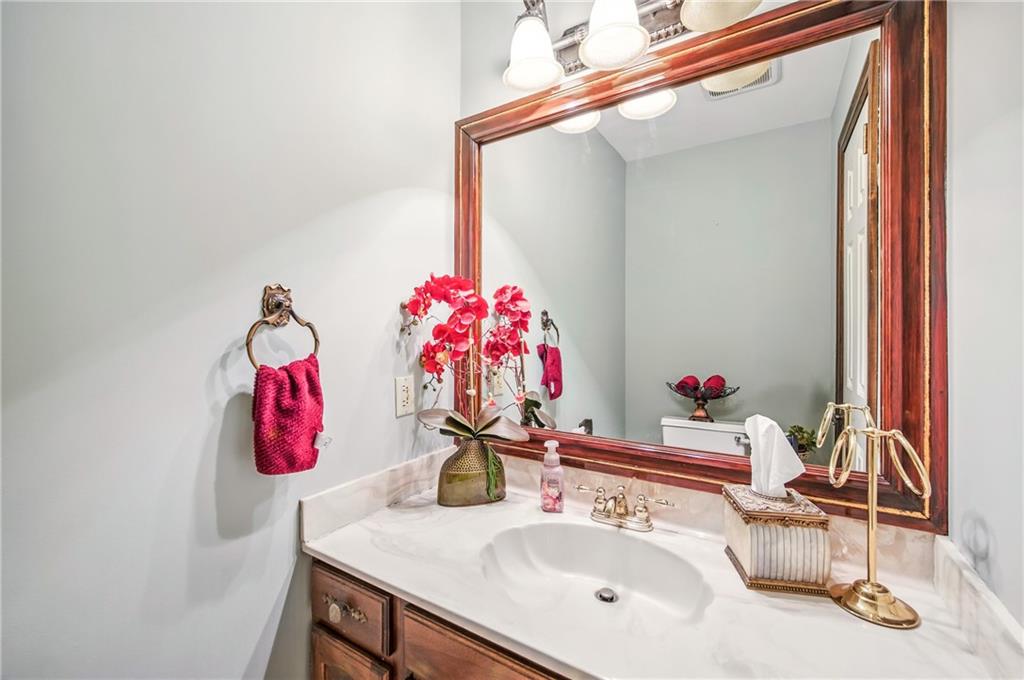 689 Tanglewood Road Hermitage, PA 16148 - Photo 18 of 42 a bathroom with a sink and a mirror