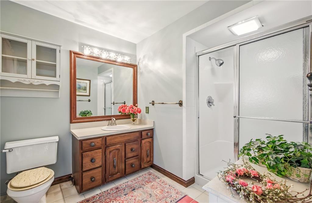 689 Tanglewood Road Hermitage, PA 16148 - Photo 24 of 42 a spacious bathroom with a shower sink vanity mirror and toilet