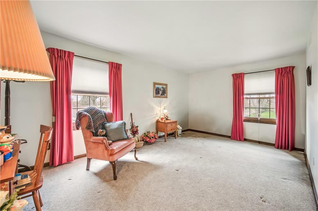 689 Tanglewood Road Hermitage, PA 16148 - Photo 29 of 42 a living room with furniture and a flat screen tv