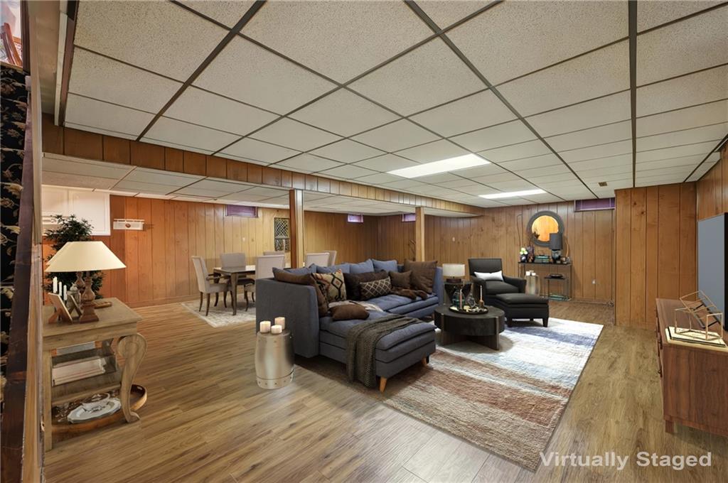 689 Tanglewood Road Hermitage, PA 16148 - Photo 34 of 42 a living room with furniture and a chandelier