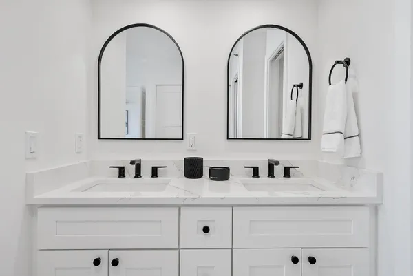 a bathroom with a glass shower door