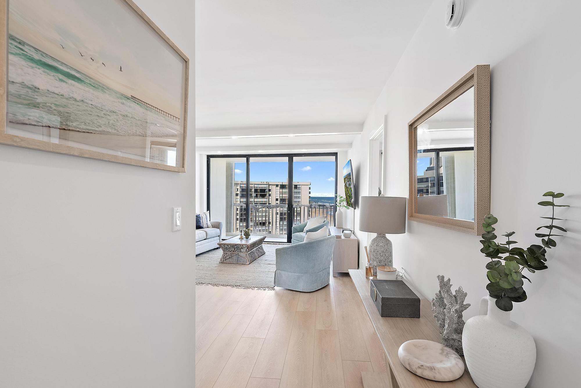 300 Ocean Trail Way, Unit 1202 Jupiter, FL 33477 - Photo 3 of 23 a living room with furniture and a potted plant