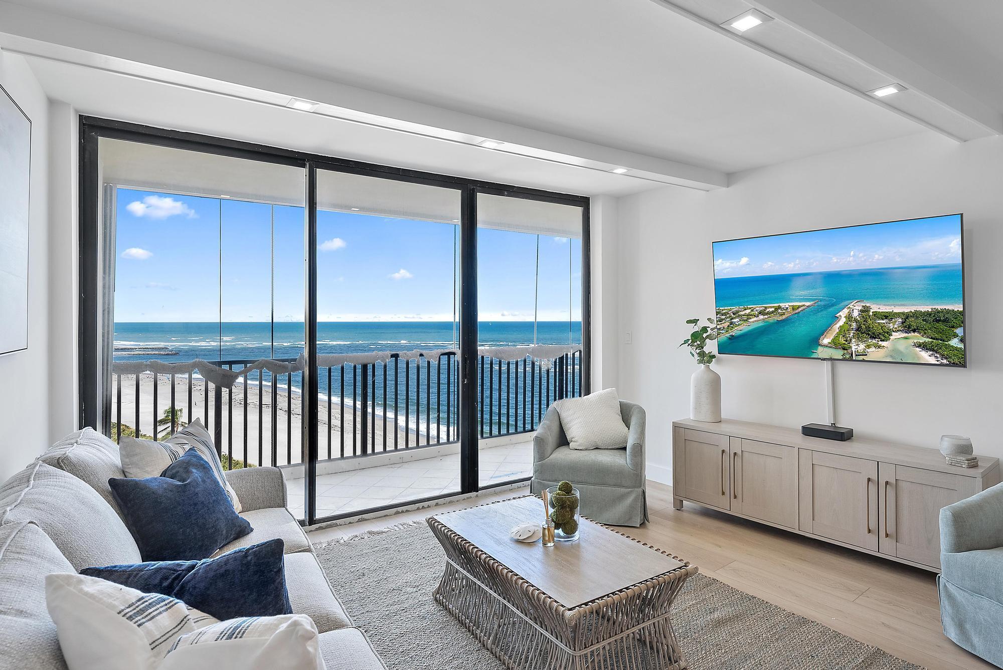 300 Ocean Trail Way, Unit 1202 Jupiter, FL 33477 - Photo 7 of 23 a living room with furniture and a large window