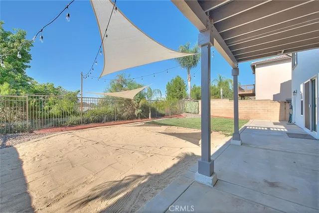 a view of a kitchen with kitchen island granite countertop a sink and a stove top oven