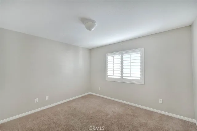 a view of a kitchen with a sink and a window