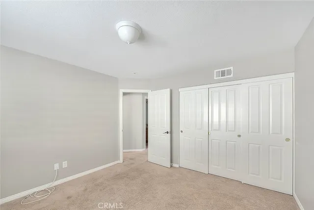 a view of an empty room with stairs