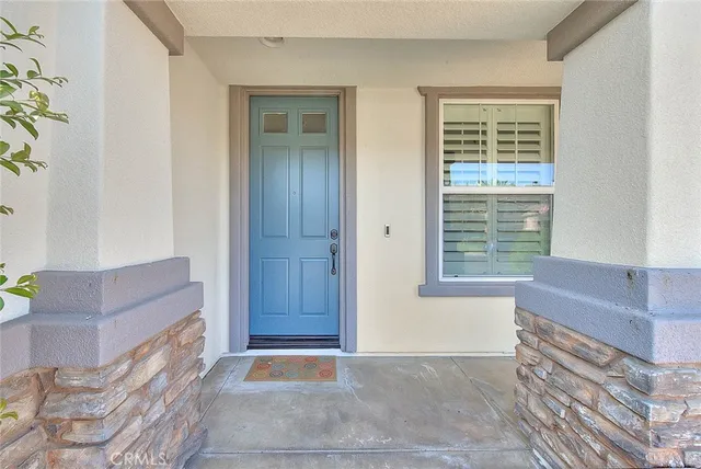 a view of room with window and front door