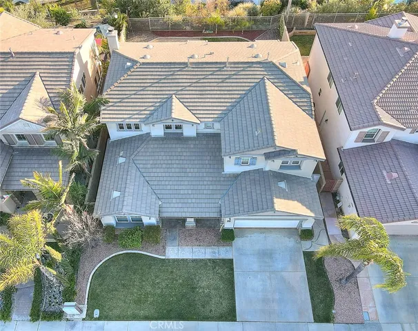a view of a house with a chairs in patio
