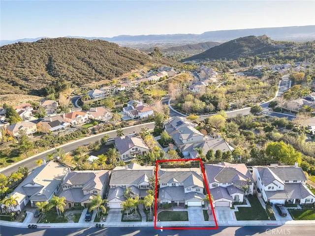 an aerial view of residential houses and street
