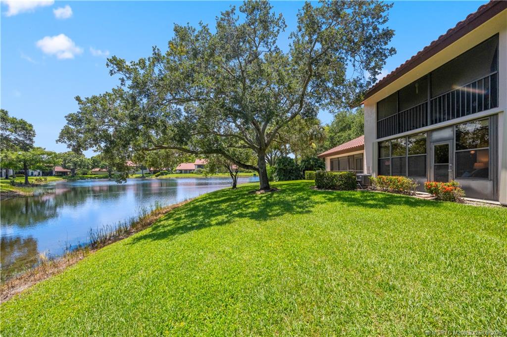 Undisclosed Address Stuart, FL 34997 - Photo 12 of 51 a view of a house with a yard and a patio