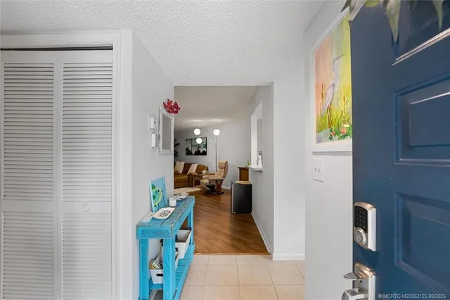 a view of a livingroom with furniture and a window