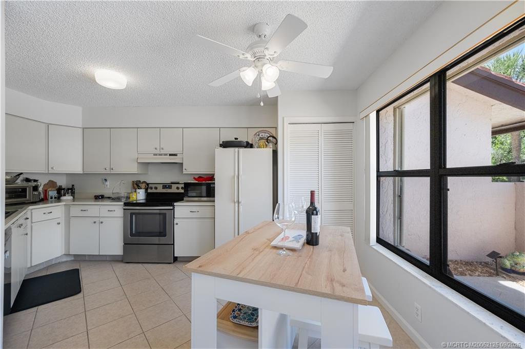 Undisclosed Address Stuart, FL 34997 - Photo 17 of 51 a kitchen with a sink appliances and cabinets