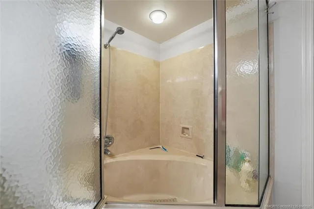 a bathroom with a bathtub and a shower