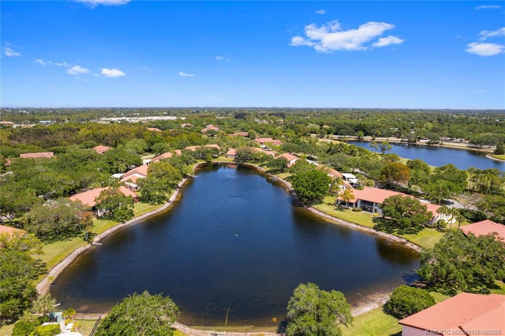 Undisclosed Address Stuart, FL 34997 - Photo 30 of 51 a view of a lake with a houses