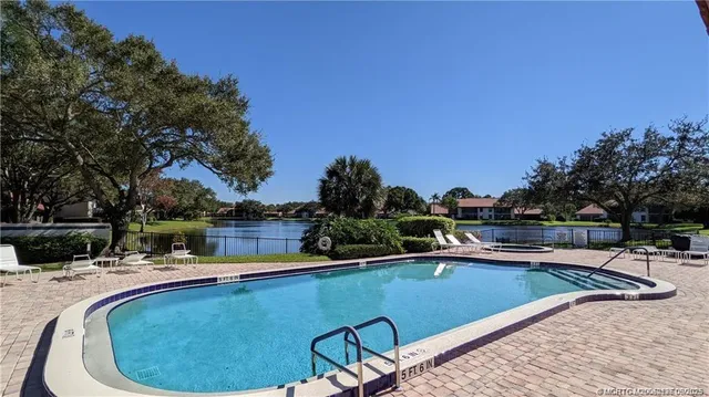 a view of a swimming pool with a patio