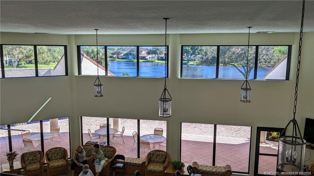 Undisclosed Address Stuart, FL 34997 - Photo 33 of 51 a front view of a building with garden