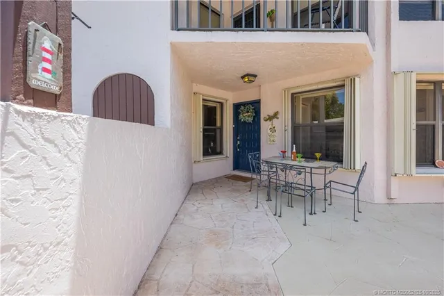 a view of a dinning room with a table and chairs
