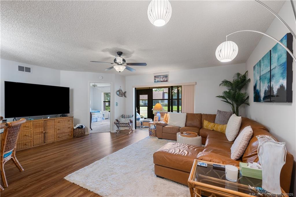 Undisclosed Address Stuart, FL 34997 - Photo 41 of 51 a living room with furniture and a flat screen tv