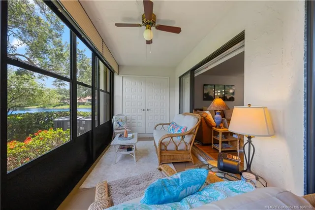 a room with furniture and a large window