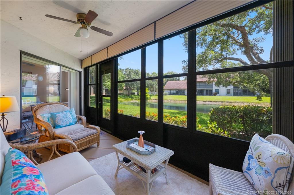Undisclosed Address Stuart, FL 34997 - Photo 5 of 51 a living room with furniture and a large window