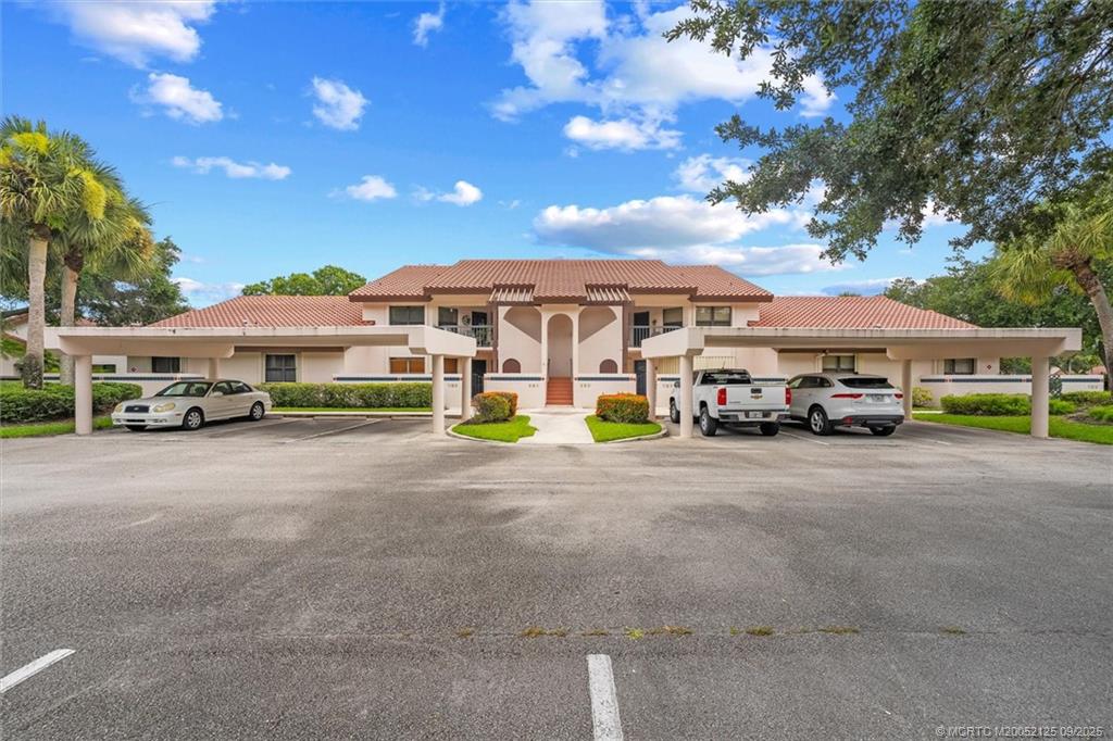 Undisclosed Address Stuart, FL 34997 - Photo 7 of 51 a double in front of a house with a street