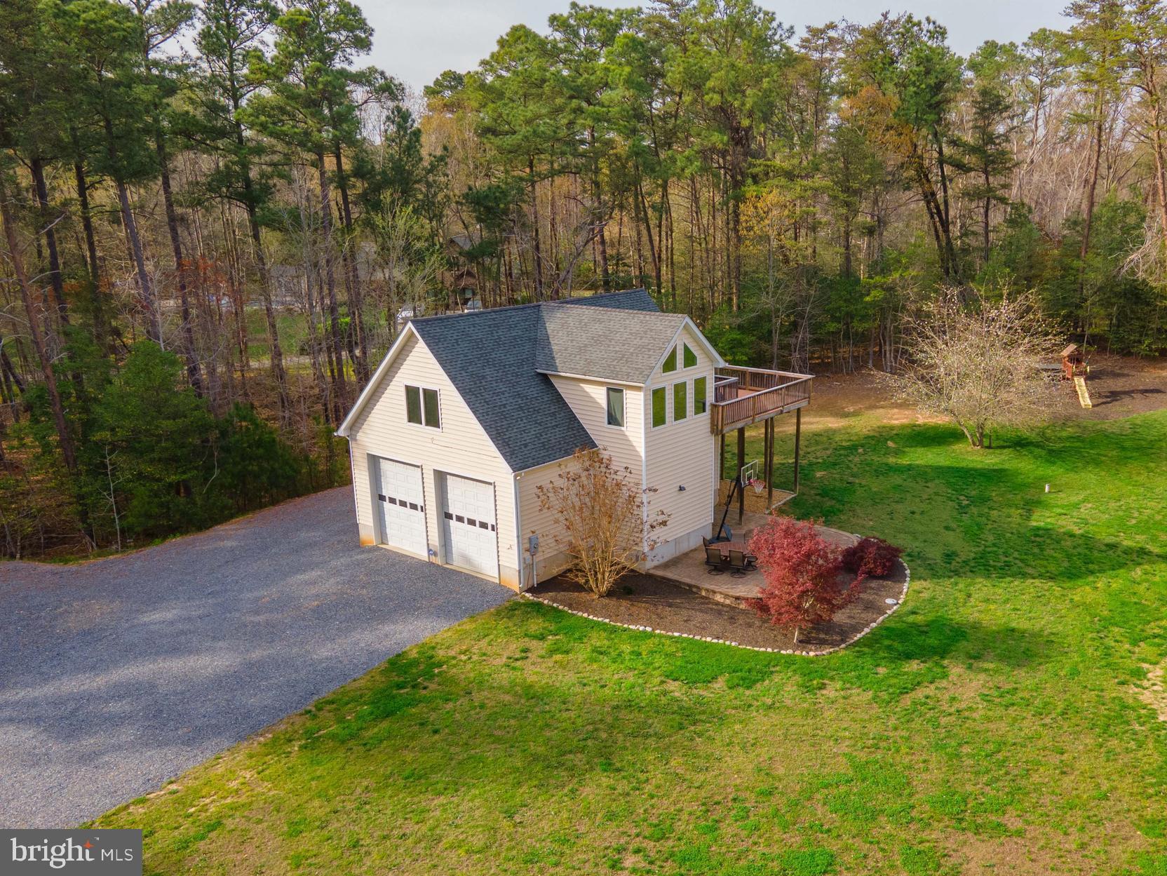 49530 Will's Road Dameron, MD 20628 - Photo 37 of 51 a aerial view of a house with a yard table and chairs