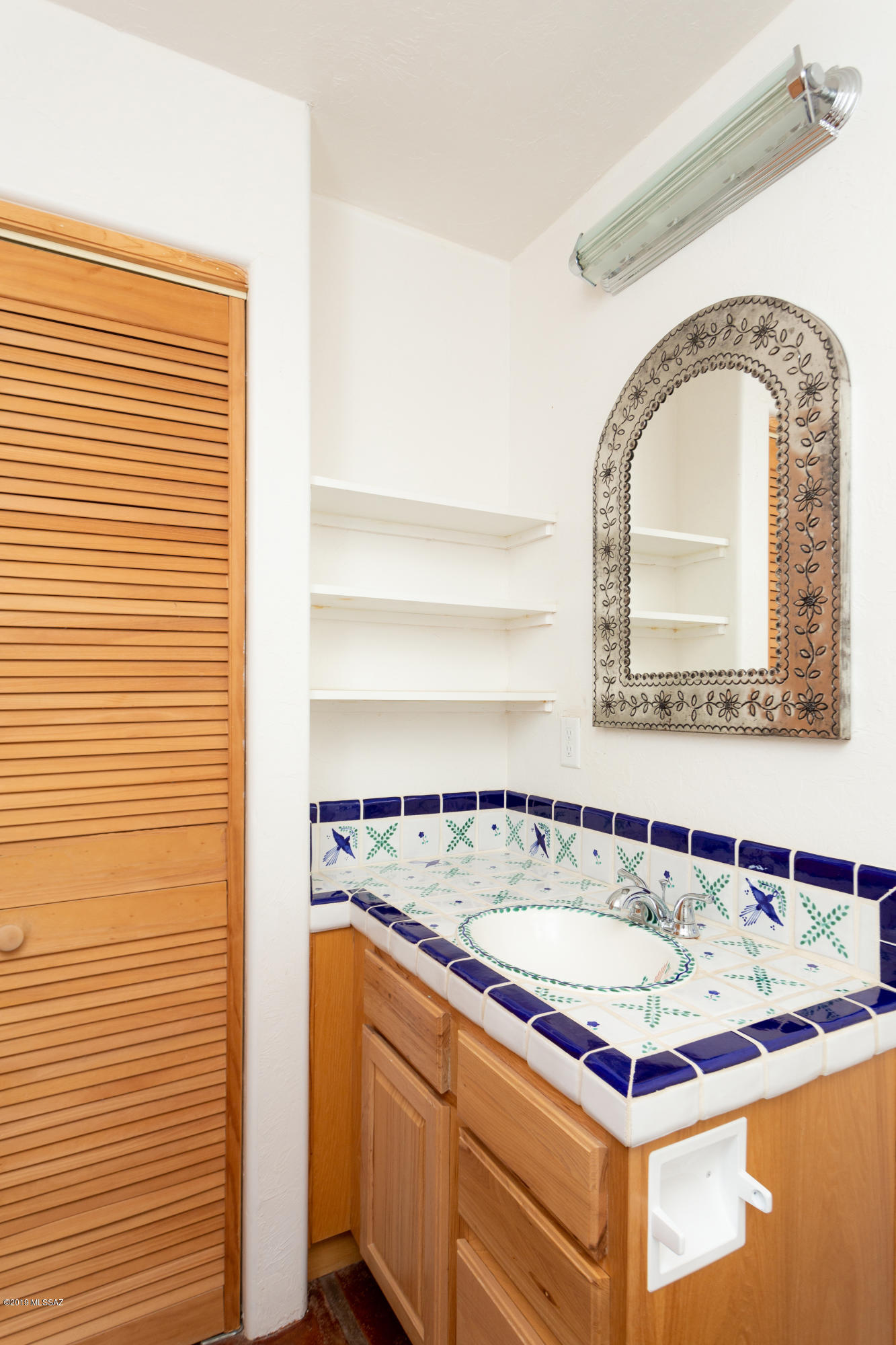 79 Camino Talavera Rio Rico, AZ 85648 - Photo 33 of 50 a view of a bathroom with a sink and mirror
