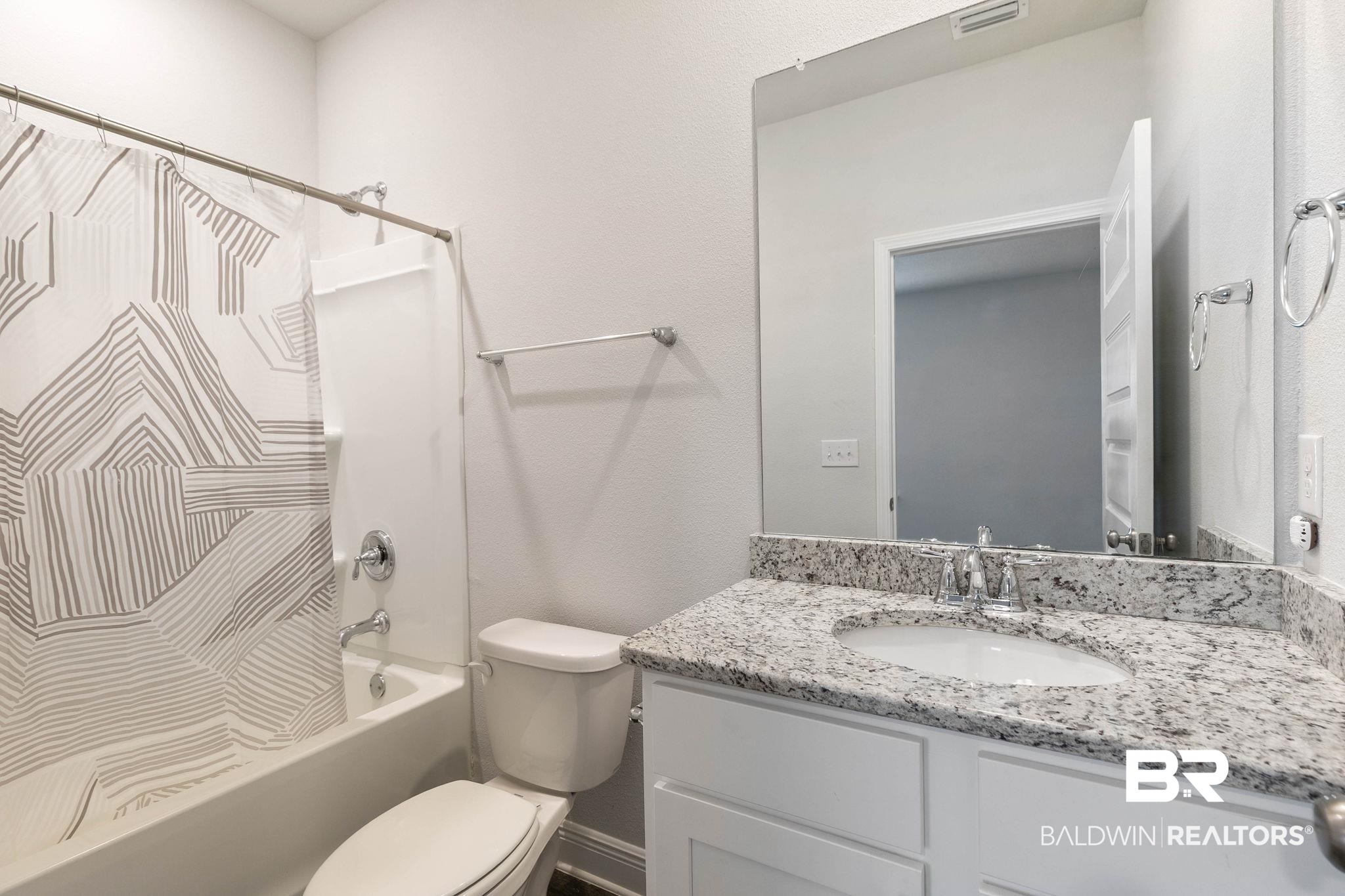 9448 Amethyst Drive Daphne, AL 36526 - Photo 44 of 61 Full bath featuring vanity, shower / tub combo, and a textured wall