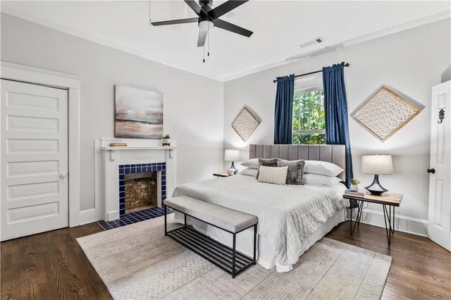 a bedroom with a bed and a fireplace