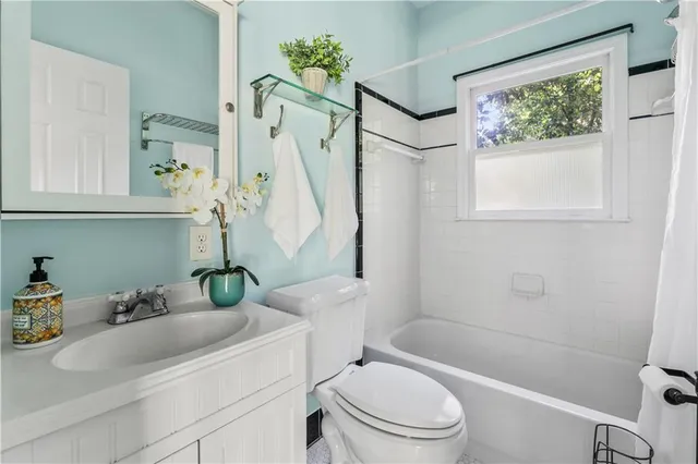 a bathroom with a sink a toilet and a bathtub
