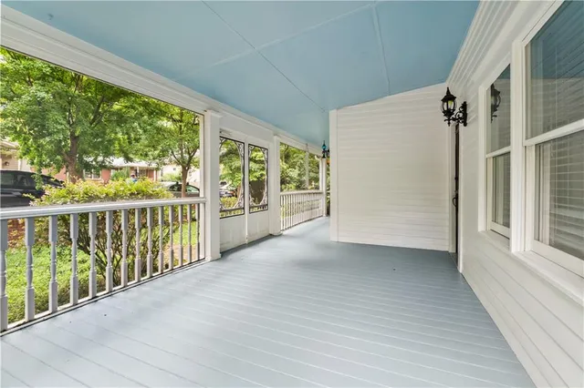a view of a balcony with wooden floor