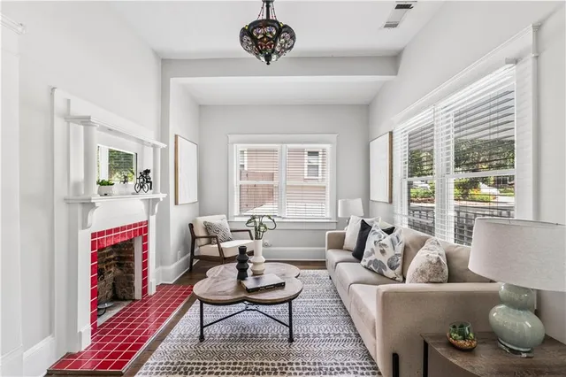 a living room with furniture or couch and a fireplace