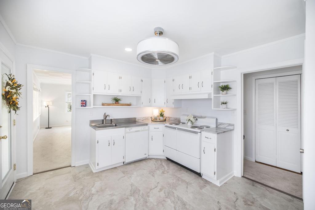 433 Pinecrest Road Macon, GA 31204 - Photo 17 of 38 a kitchen with white cabinets and white appliances