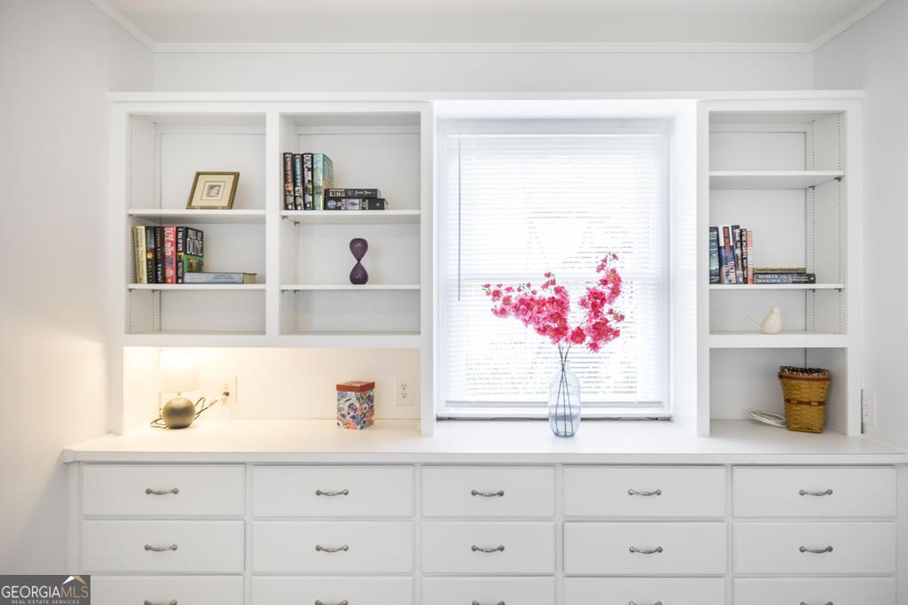 433 Pinecrest Road Macon, GA 31204 - Photo 22 of 38 a kitchen with white cabinets and window