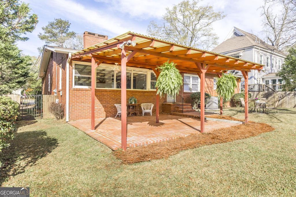 433 Pinecrest Road Macon, GA 31204 - Photo 32 of 38 a view of a house with backyard porch and sitting area