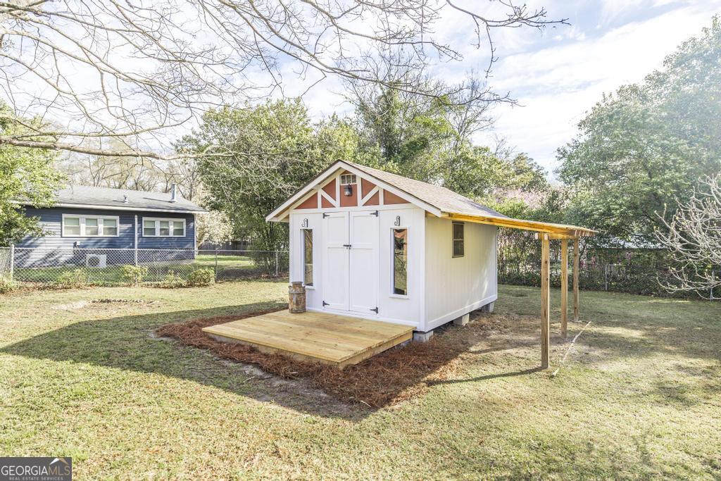 433 Pinecrest Road Macon, GA 31204 - Photo 35 of 38 a view of a house with a yard