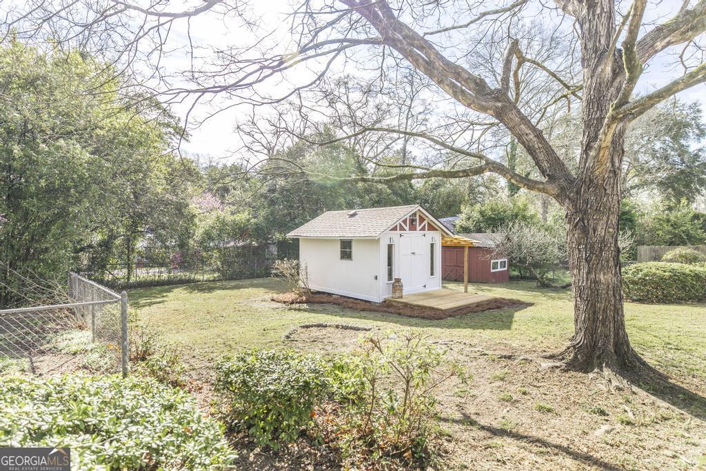 433 Pinecrest Road Macon, GA 31204 - Photo 37 of 38 a white house that has a tree in front of it