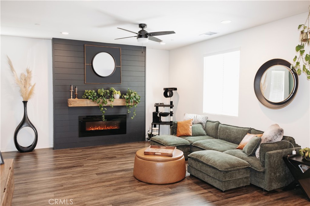 30319 Ramsay Drive Menifee, CA 92584 - Photo 3 of 8 a living room with furniture and a wooden floor