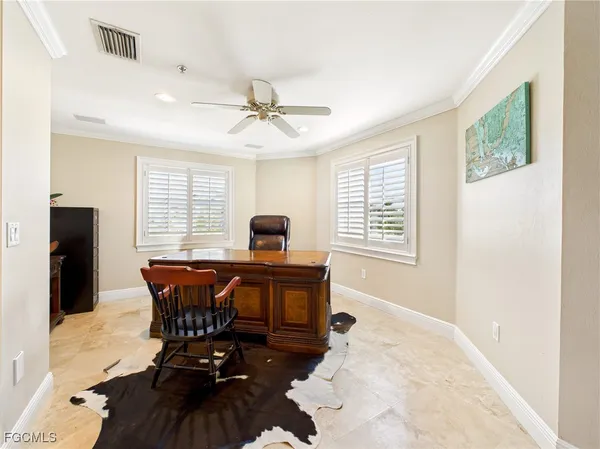 a view of a workspace with furniture window and wooden floor