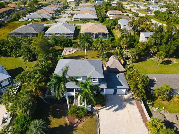 an aerial view of multiple houses with yard