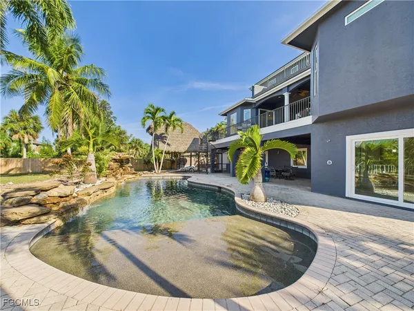 a view of a swimming pool with a patio